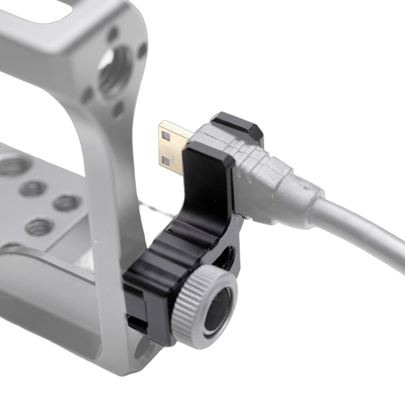 HDMI cable routed through the strain-relief clamp